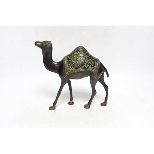 437 - An Eastern bronze figure of a camel, 22cm wide