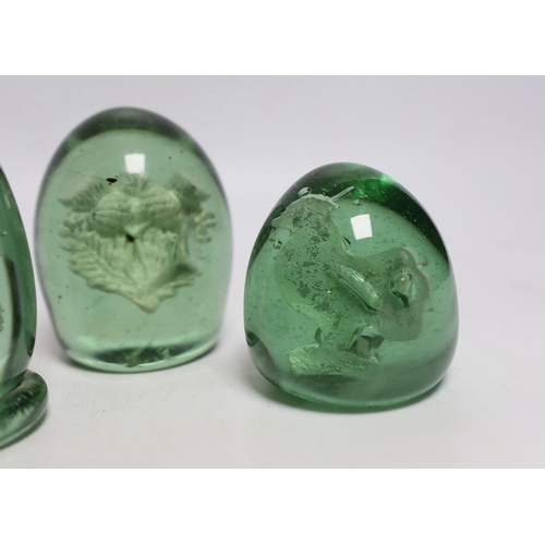 438 - Five green glass dumps, including two with inset sulphides, tallest 9cm