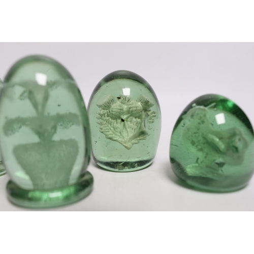 438 - Five green glass dumps, including two with inset sulphides, tallest 9cm