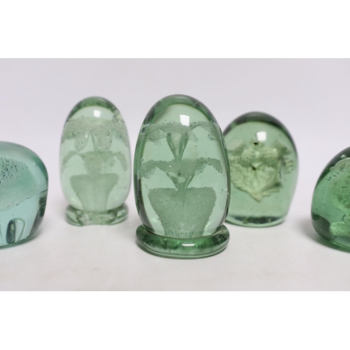 438 - Five green glass dumps, including two with inset sulphides, tallest 9cm