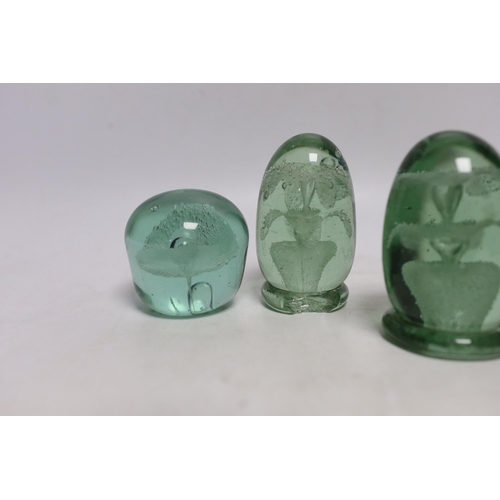 438 - Five green glass dumps, including two with inset sulphides, tallest 9cm