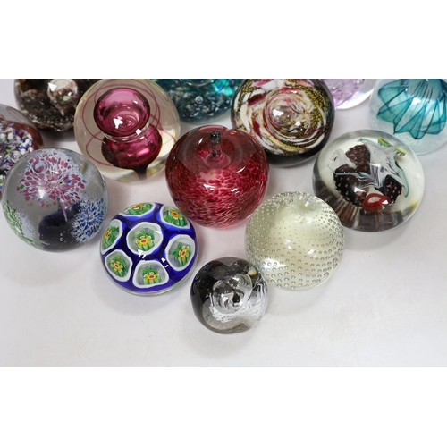 443 - Thirteen glass paperweights including Caithness and Murano, largest 9cm in diameter