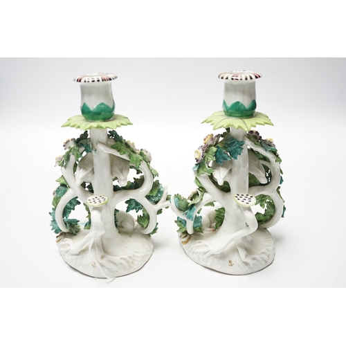 454 - A pair of Samson porcelain chambersticks, in Derby style, with floral encrusted decoration, 19cm hig... 