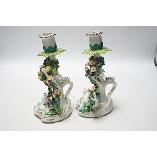 454 - A pair of Samson porcelain chambersticks, in Derby style, with floral encrusted decoration, 19cm hig... 