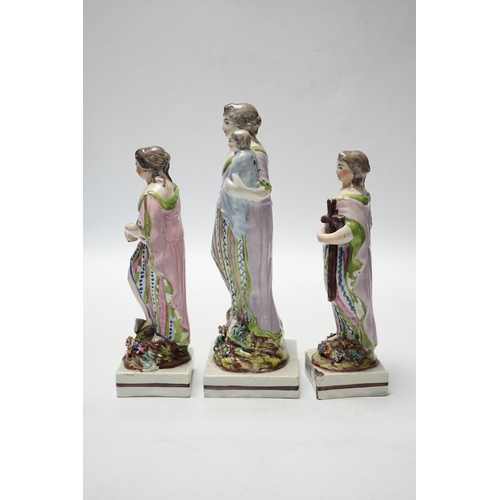 455 - A set of three pearlware figures of Faith, Hope and Charity, c.1810, largest 21cm high