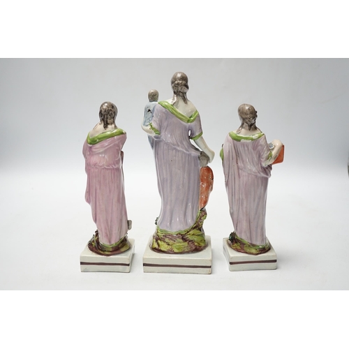 455 - A set of three pearlware figures of Faith, Hope and Charity, c.1810, largest 21cm high