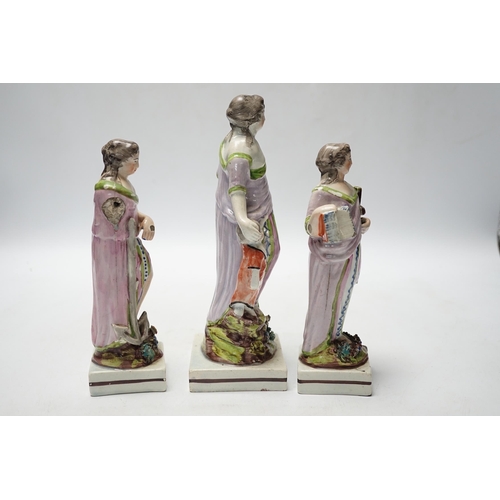 455 - A set of three pearlware figures of Faith, Hope and Charity, c.1810, largest 21cm high