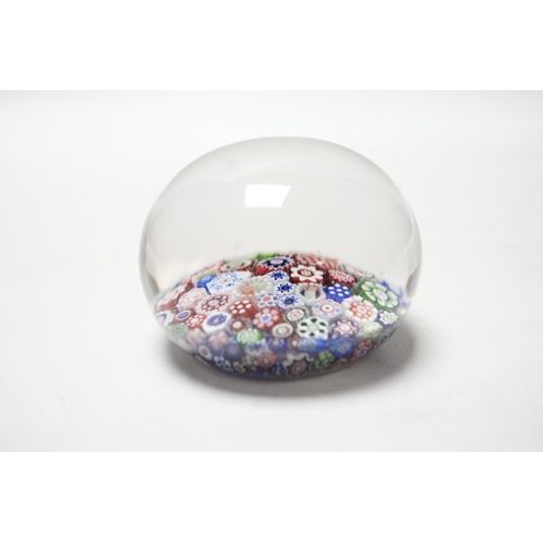 463 - A Baccarat close packed millefiori paperweight with two rose corner, 7cm diameter