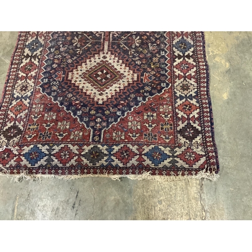 47 - A Caucasian style blue ground rug, 146 x 78cm