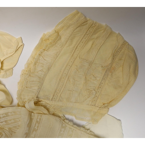 474 - Two 19th century silk baby gowns, a ladies lace trimmed bonnet, a black satin and lace maids apron, ... 