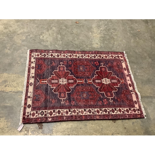 54 - A Turkish blue ground rug, 144 x 102cm