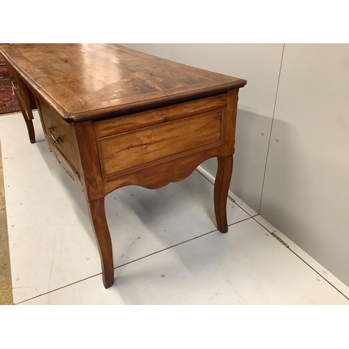 56 - A late 18th century French Provincial fruitwood kneehole table, width 178cm, depth 70cm, height 74cm... 