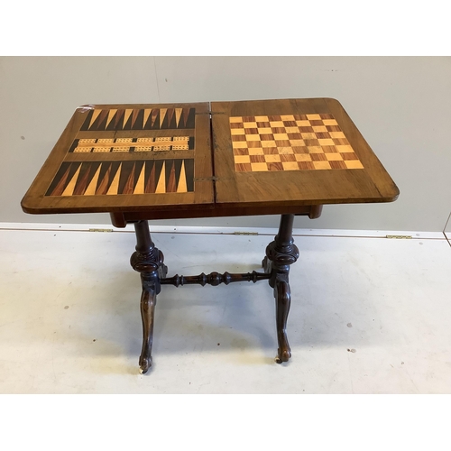 61 - A Victorian walnut rectangular folding games table, width 54cm, depth 40cm, height 72cm