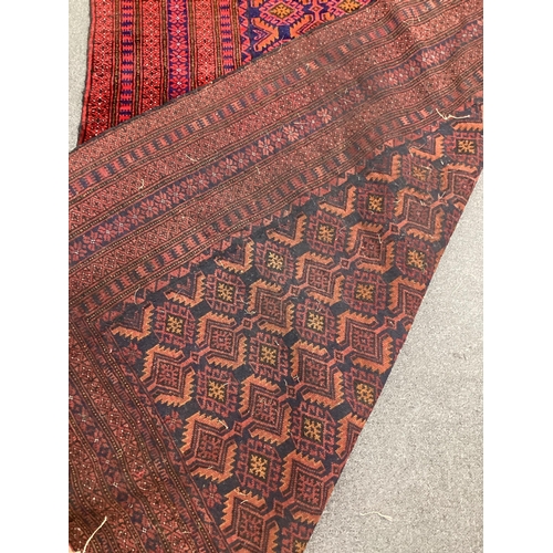 65 - An Afghan blue ground rug, 216cm x 130cm