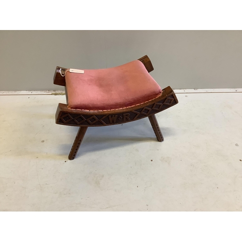 70 - A Liberty chip carved stool, dated 1893, width 56cm, height 34cm