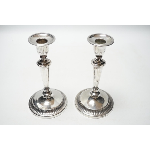 827 - A pair of George V silver mounted candlesticks, Thomas Bradbury & Sons, Sheffield, 1919, 18.6cm, wei... 