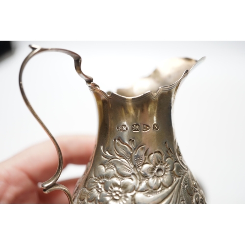 833 - A Victorian silver inverted pyriform cream jug, London, 1886, 10.4cm, another, embossed, Chester, 18... 