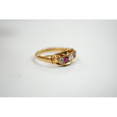 916 - A George V 18ct gold, three stone diamond and two stone ruby set half hoop ring, size N, gross weigh... 