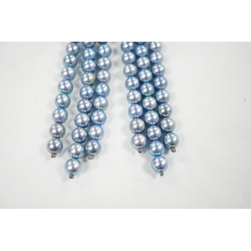 917 - A modern pair of white metal, diamond chip cluster and bluey/grey three row cultured pearl tassel dr... 