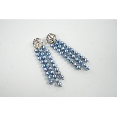 917 - A modern pair of white metal, diamond chip cluster and bluey/grey three row cultured pearl tassel dr... 