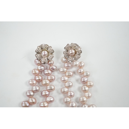 918 - A modern pair of white metal, diamond chip cluster and three row pink cultured pearl tassel drop ear... 