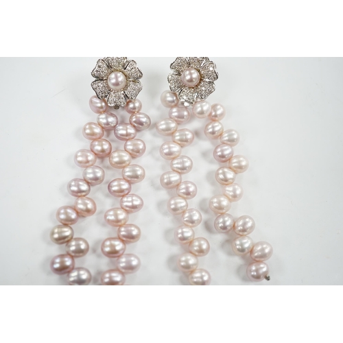 918 - A modern pair of white metal, diamond chip cluster and three row pink cultured pearl tassel drop ear... 