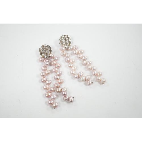 918 - A modern pair of white metal, diamond chip cluster and three row pink cultured pearl tassel drop ear... 