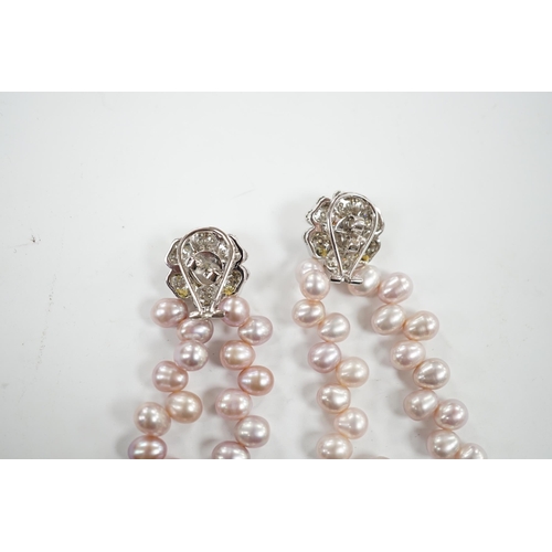 918 - A modern pair of white metal, diamond chip cluster and three row pink cultured pearl tassel drop ear... 