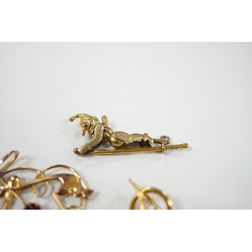 926 - An Art Nouveau yellow metal and two stone gem set drop pendant, 53mm, an articulated Mr Punch charm ... 