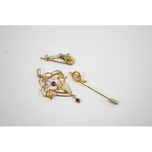 926 - An Art Nouveau yellow metal and two stone gem set drop pendant, 53mm, an articulated Mr Punch charm ... 