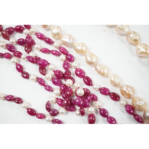 927 - A modern cultured pearl and polished ruby? bead necklace, with two stone diamond chip set 750 clasp,... 