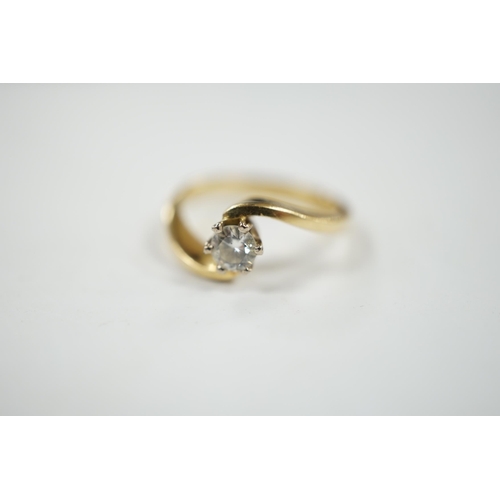 929 - A modern 18ct gold and solitaire diamond set ring, with crossover shoulders, size K, gross weight 4 ... 