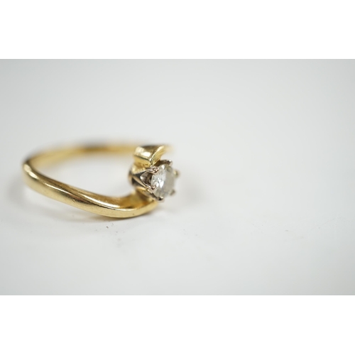 929 - A modern 18ct gold and solitaire diamond set ring, with crossover shoulders, size K, gross weight 4 ... 