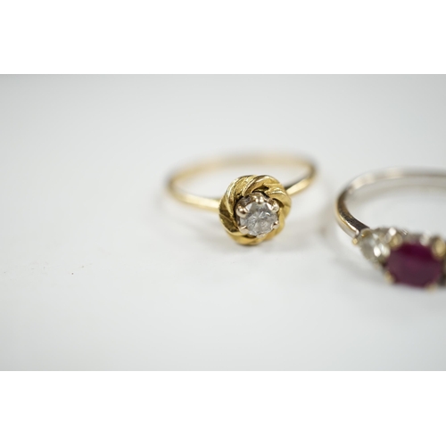 930 - A modern 18ct white gold, ruby and diamond set three stone ring, size N/O and a 1970's 18ct gold and... 