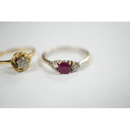 930 - A modern 18ct white gold, ruby and diamond set three stone ring, size N/O and a 1970's 18ct gold and... 