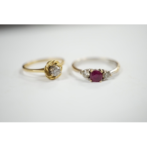 930 - A modern 18ct white gold, ruby and diamond set three stone ring, size N/O and a 1970's 18ct gold and... 