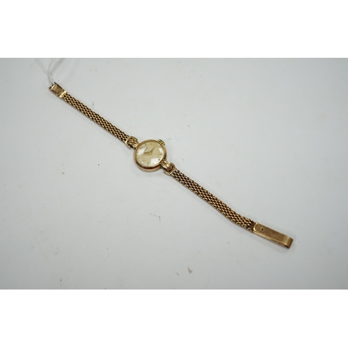 940 - A lady's 9ct gold Jaeger LeCoultre manual wind wrist watch, on an associated 9ct gold bracelet, over... 