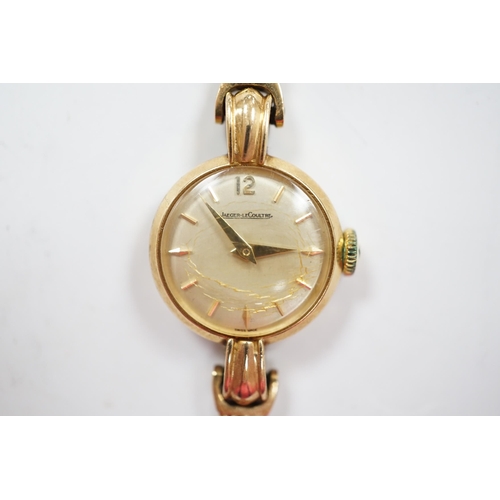 940 - A lady's 9ct gold Jaeger LeCoultre manual wind wrist watch, on an associated 9ct gold bracelet, over... 