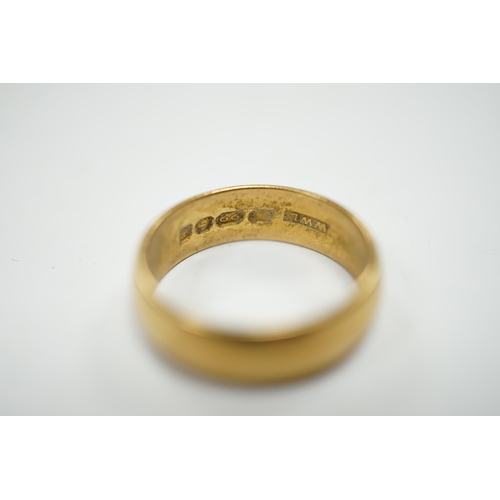 943 - A 1960's 22ct gold wedding band, size M, 6 grams.