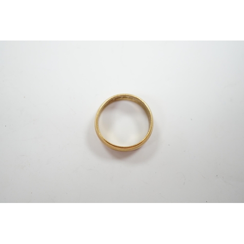 943 - A 1960's 22ct gold wedding band, size M, 6 grams.