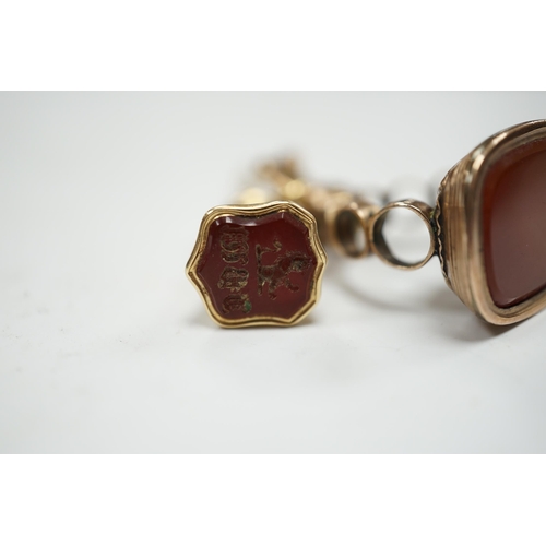 944 - A 19th century engraved yellow metal overlaid and carnelian set trumpet shaped watch key, the matrix... 