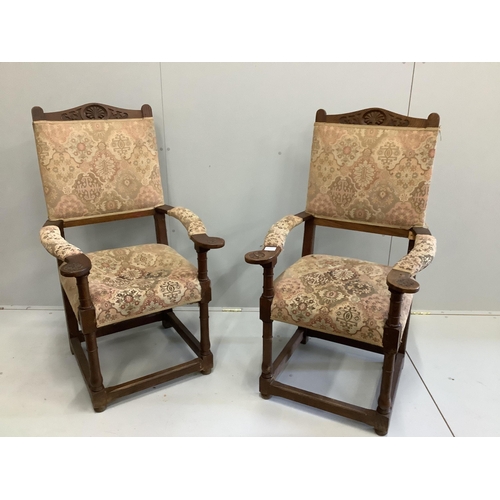 110 - A pair of oak elbow chairs, width 64cm, depth 60cm, height 114cm