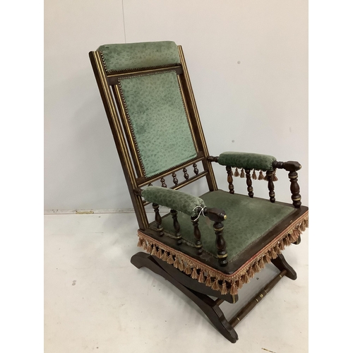 111 - A 19th century American mahogany rocking chair, width 58cm, depth 54cm, height 100cm