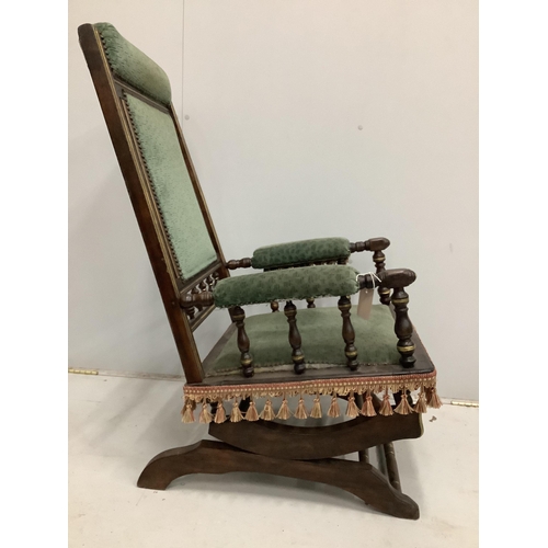 111 - A 19th century American mahogany rocking chair, width 58cm, depth 54cm, height 100cm