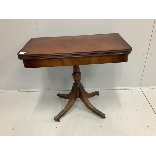 115 - A reproduction Regency style mahogany folding tea table, width 85cm, depth 42cm, height 76cm