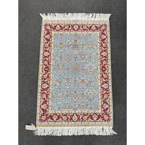 163 - A North West Persian part silk blue ground mat, 90 x 60cm.