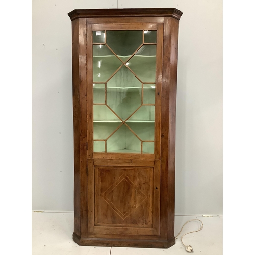 24 - A George III mahogany standing corner cupboard, width 93cm, depth 50cm, height 198cm