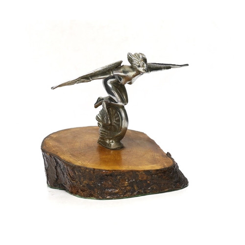 260 - A vintage chrome plated car mascot of a winged female riding a wheel, mounted on a tree trunk cross-... 