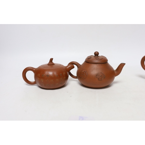 263 - Four Chinese Yixing teapots, one slip decorated with a landscape, tallest 10.5cm Provenance- from a ... 