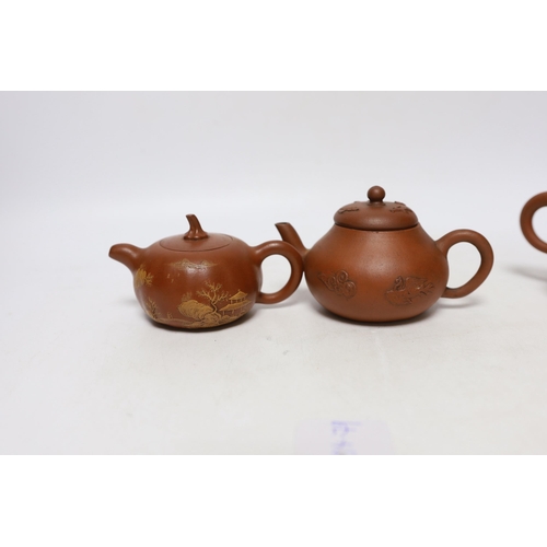 263 - Four Chinese Yixing teapots, one slip decorated with a landscape, tallest 10.5cm Provenance- from a ... 